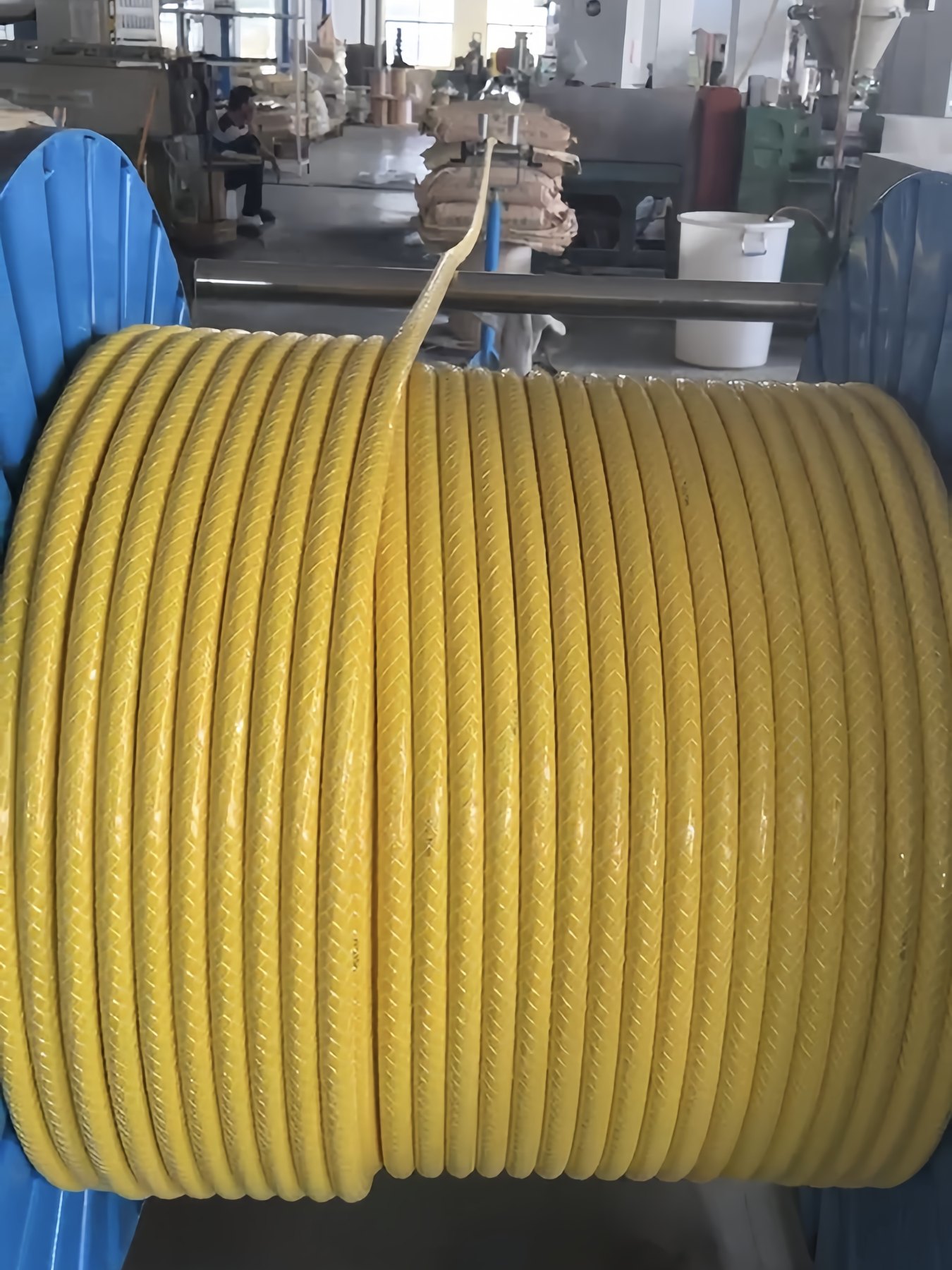 Yellow cable reel in workshop